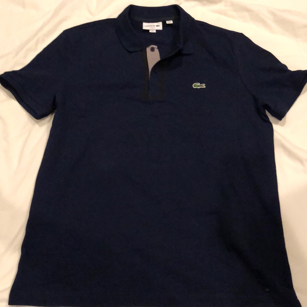 Blue Lacoste shirt with black outline